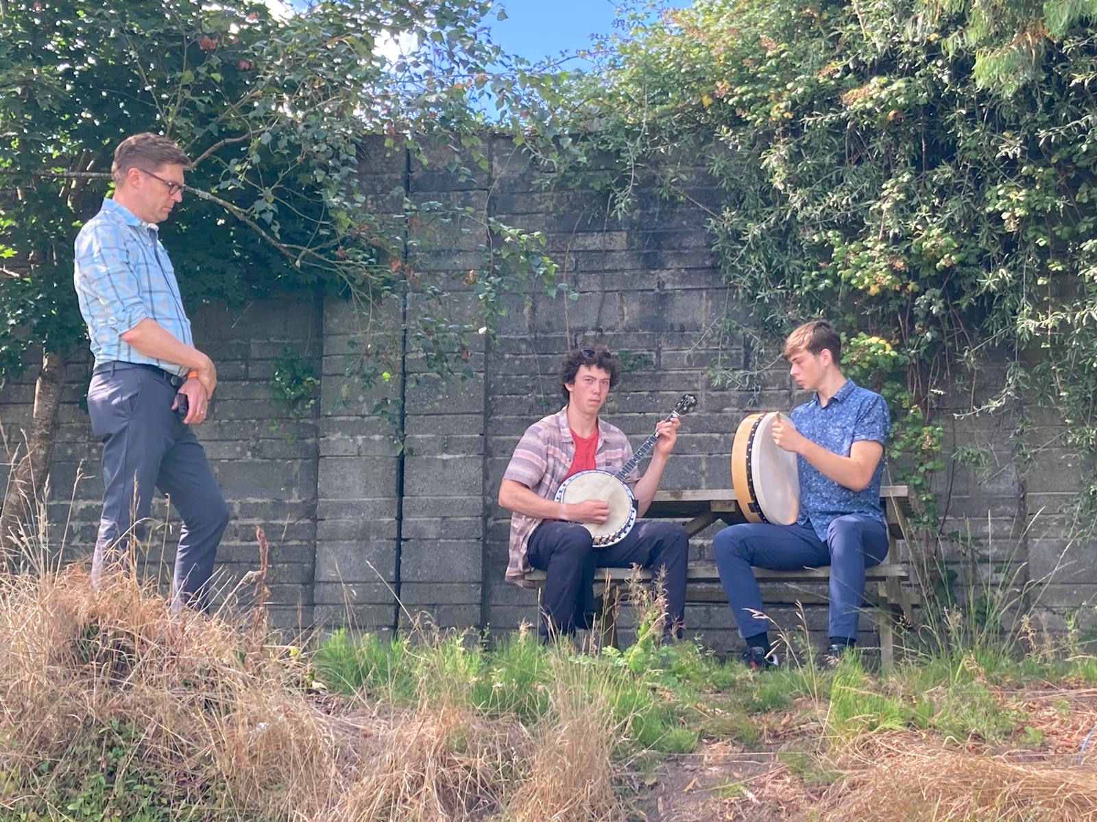 Brian listening to Henry and Teddy Brandt rehearsing for Teddy’s bodhrán competition.