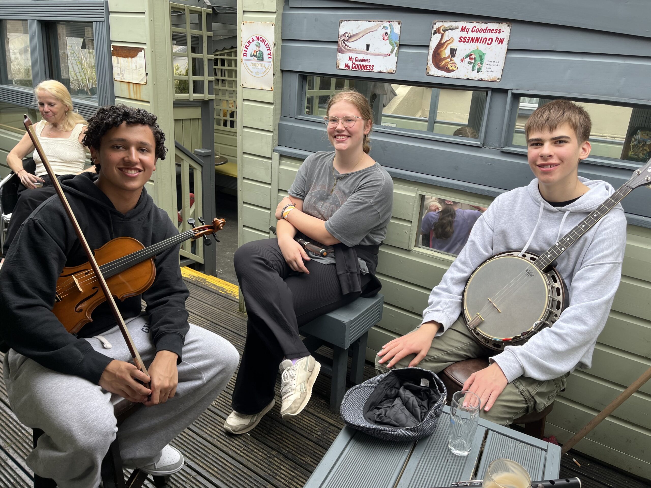 Musicians Arjun Ramachadran, Nevellie Larson and Collin Fenton share a tune.